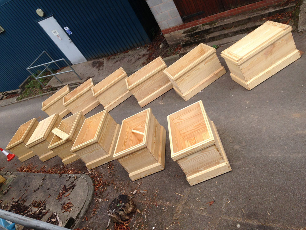 A dozen of the 19 chests we built in five days.