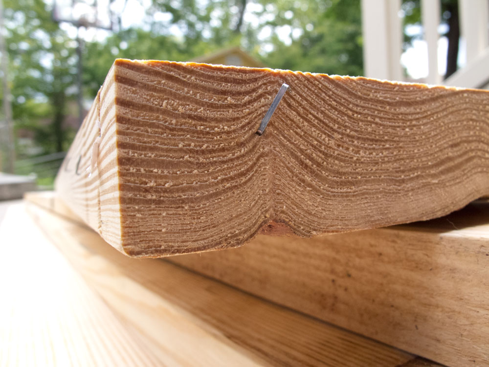 Look for tight growth rings. These boards will be denser and more durable.
