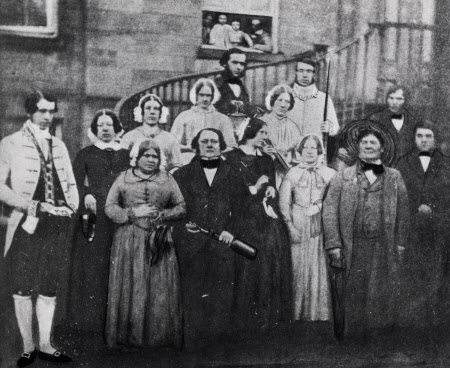 Erddig servants on the front steps. Thomas Rodgers is front row, second from right; his son James is next to him.