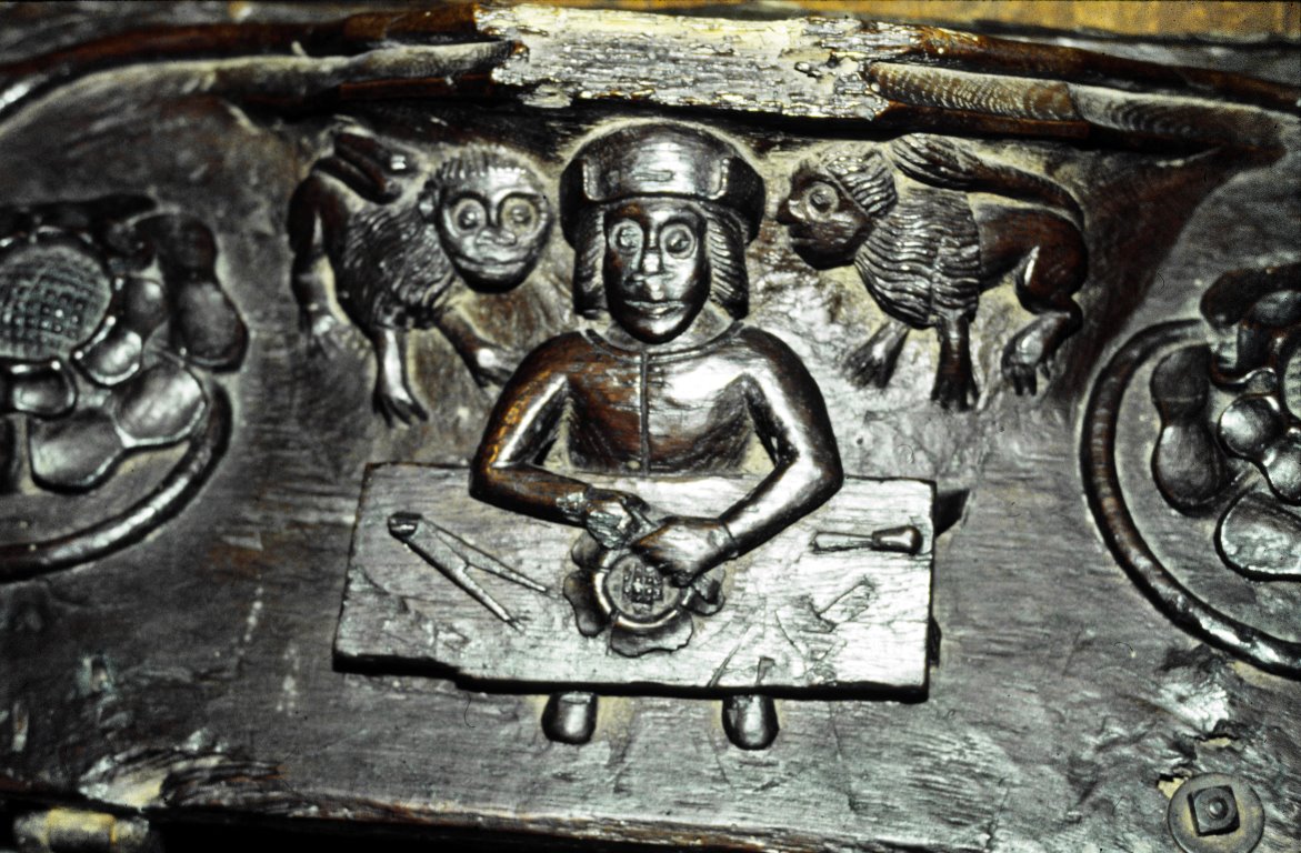 Carver working on a rose, 15th c., St. Nicholas, Great Doddington, Northampshire.