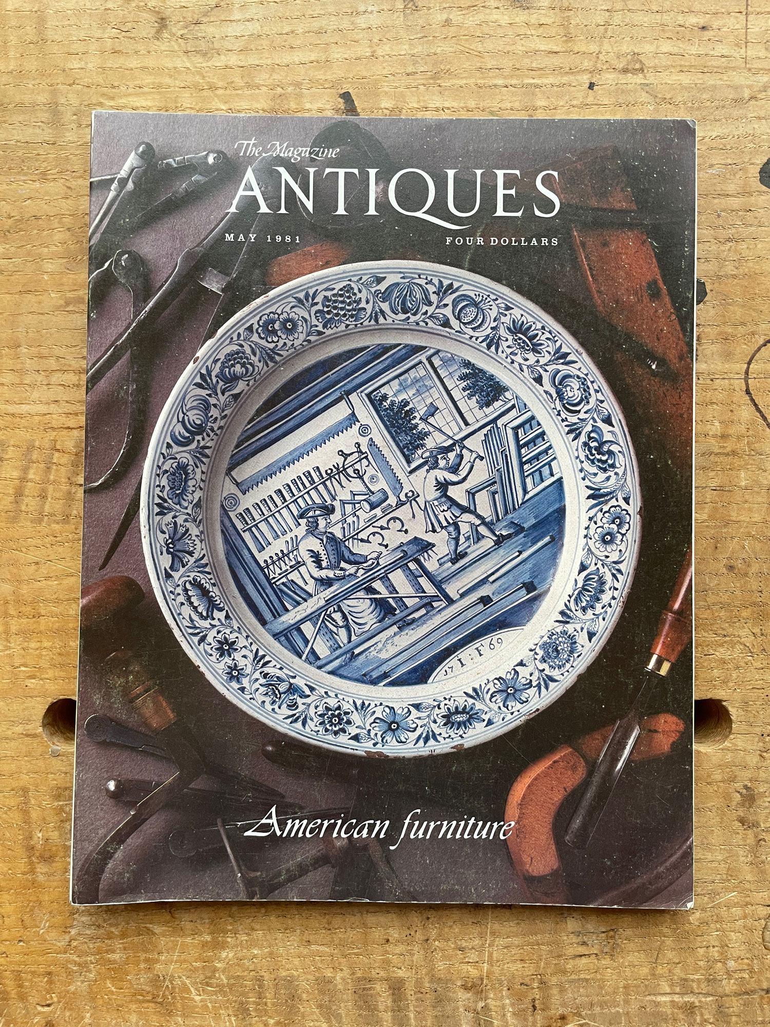 The front cover of the May 1981 The Magazine Antiques featuring a delft plate of a woodworking scene