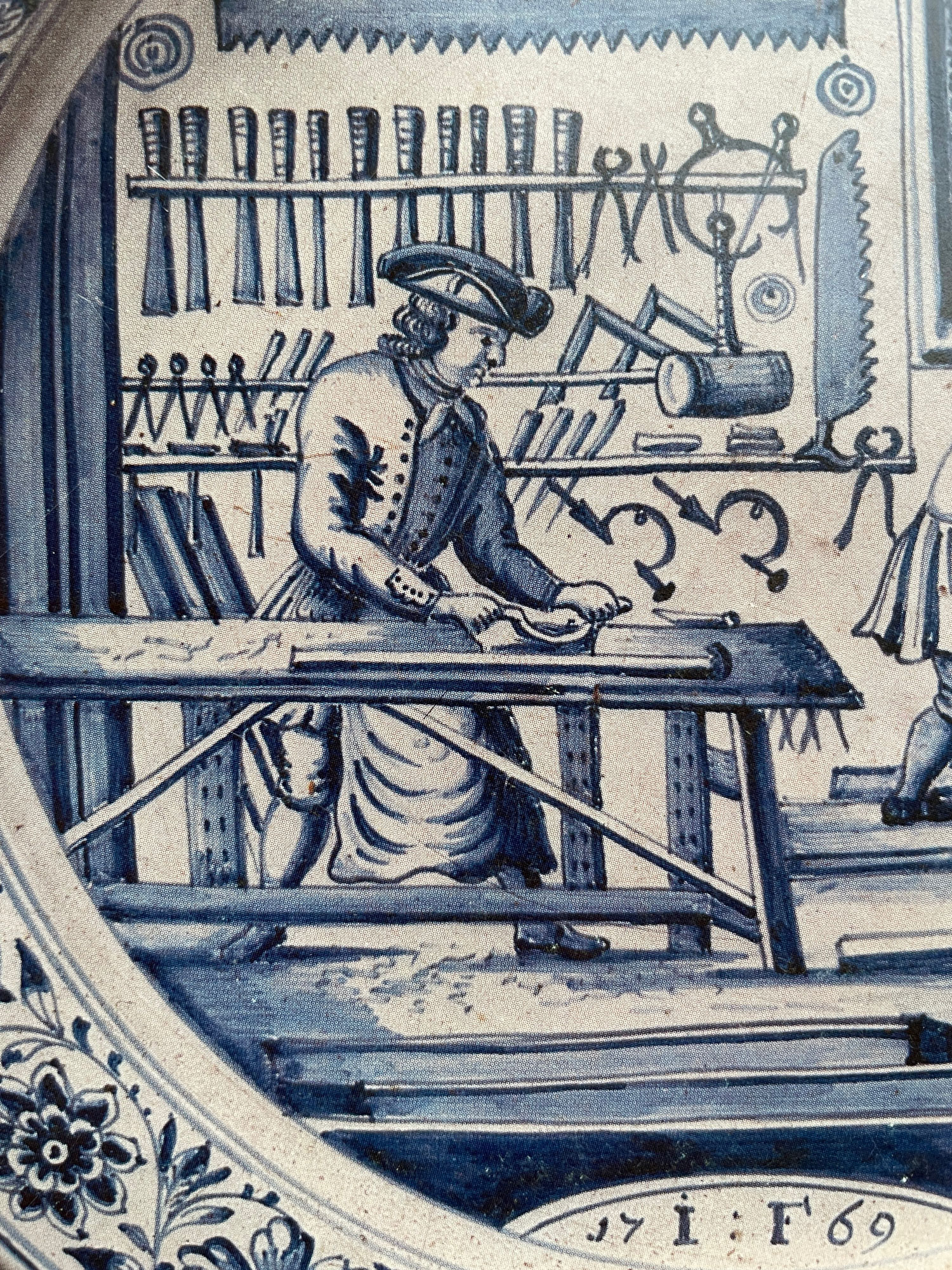 An image of a woodworker at a workbench, perhaps using a travisher or scorp.