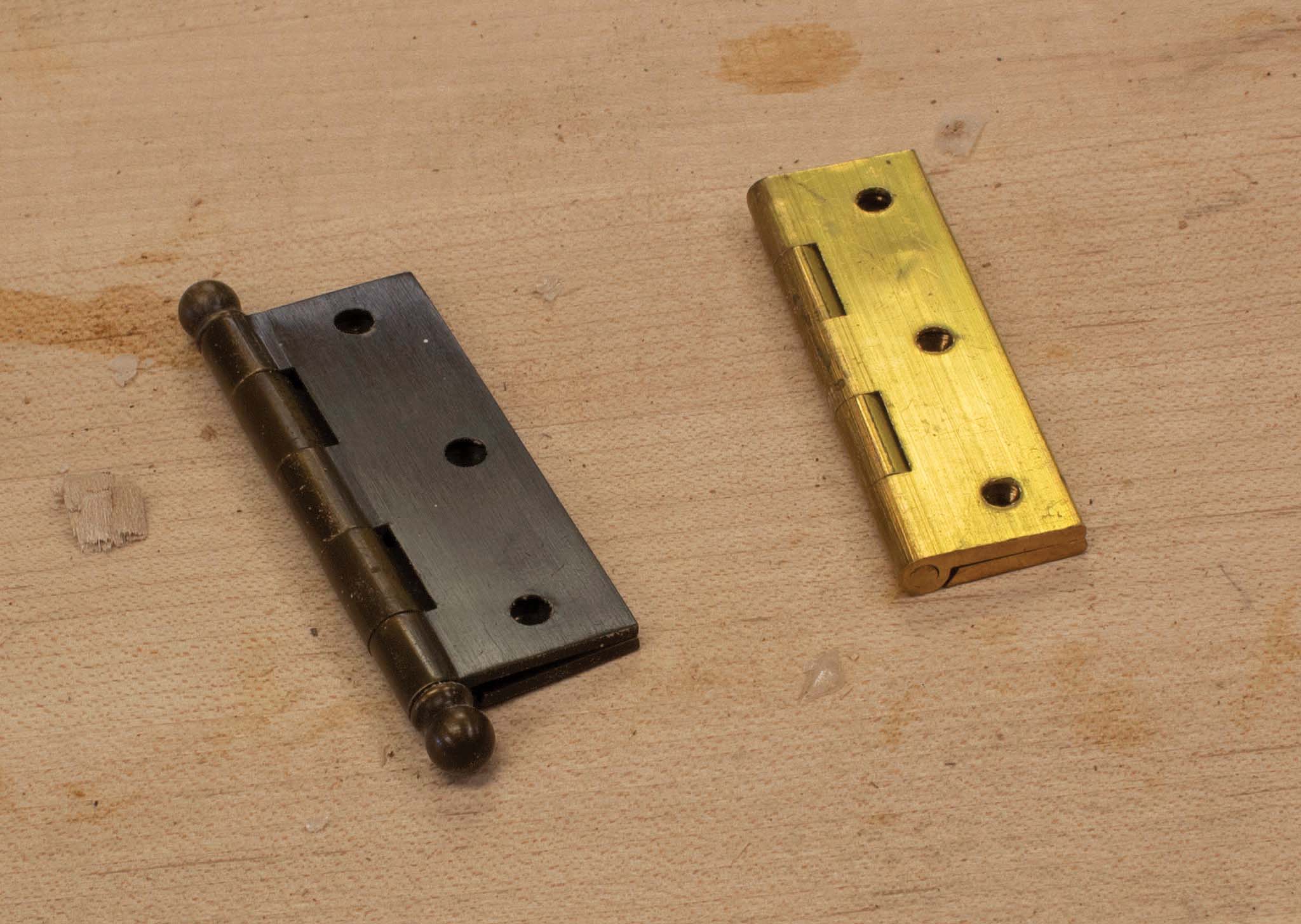 A butt hinge with a fixed pin and a butt hinge with a loose pin