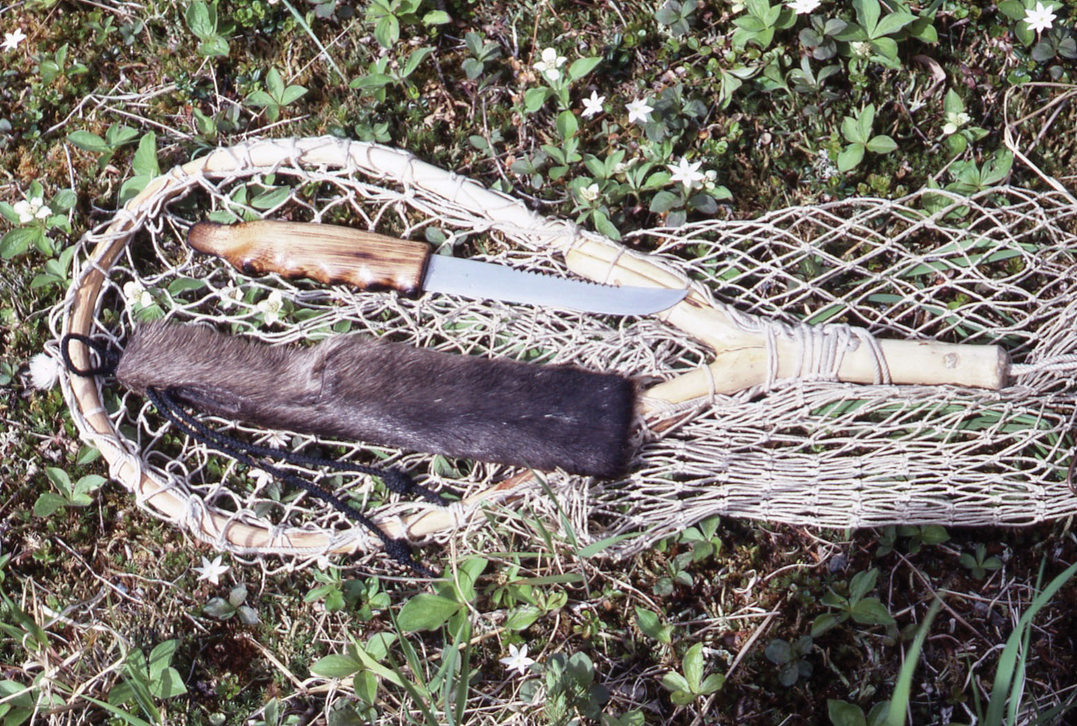 Making spoon lure in a primitive way in a tree 